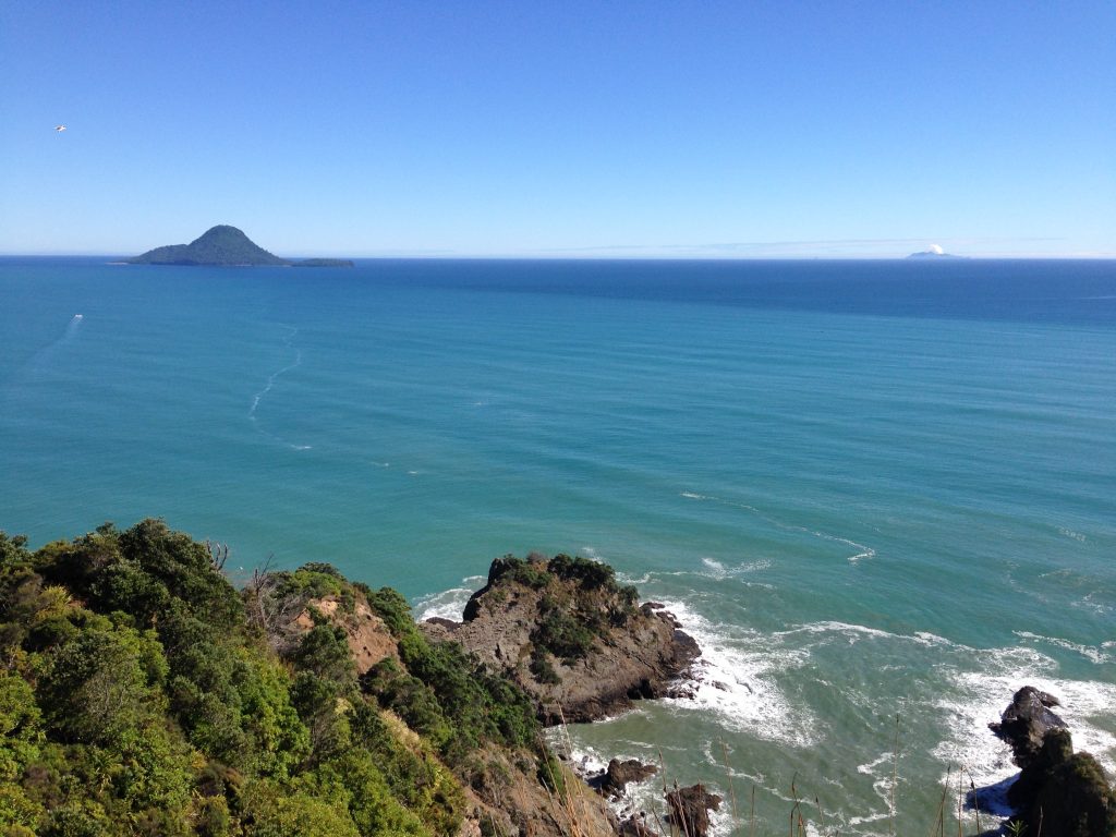 Whale Island and White Island as seen from high up on the Ngā Tapuwae o Toi walking track.