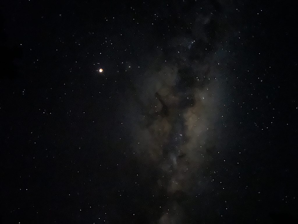 The core of the Milky Way galaxy, with Earth's moon nearby.