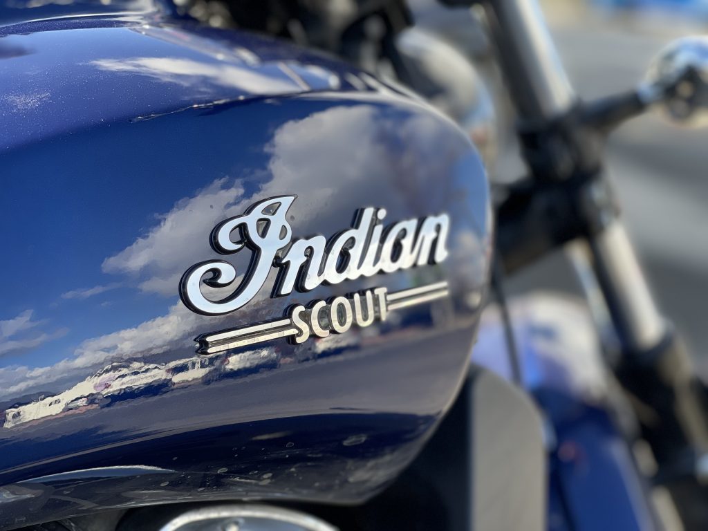 Closeup view of the logo on the gas tank of an Indian Scout motorcycle.