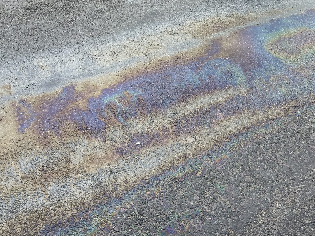 A thick oil slick on a wet road.