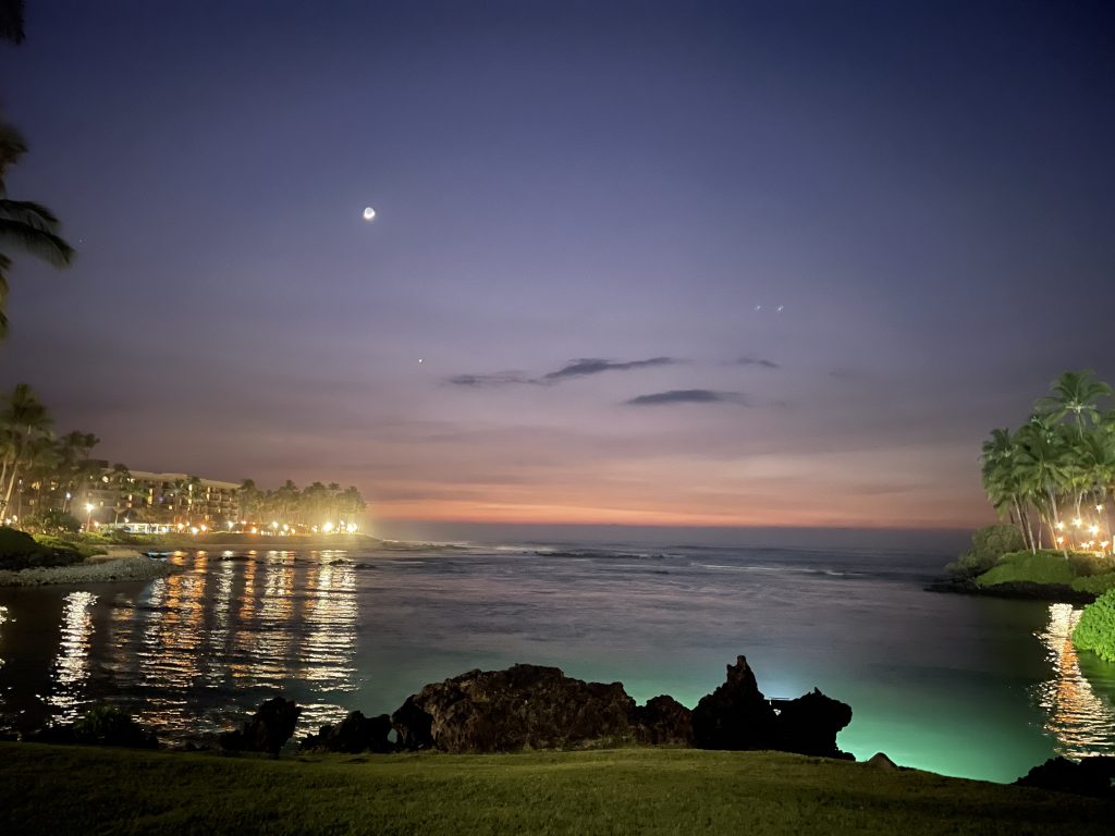 Night view of the coastal area at a Hawaiian resort.