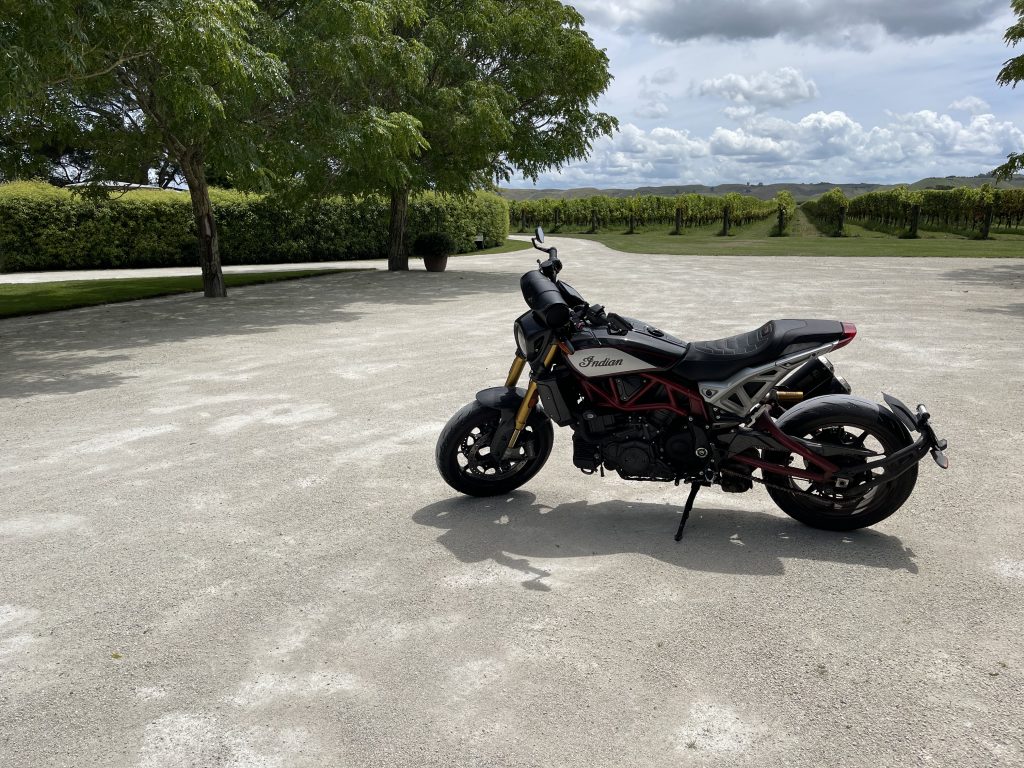 An Indian FTR 1200 motorcycle in the carpark at Alpha Domus vineyard.