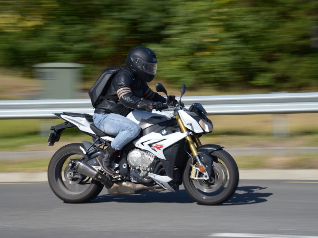 The site owner riding a BMW S1000R motorcycle.