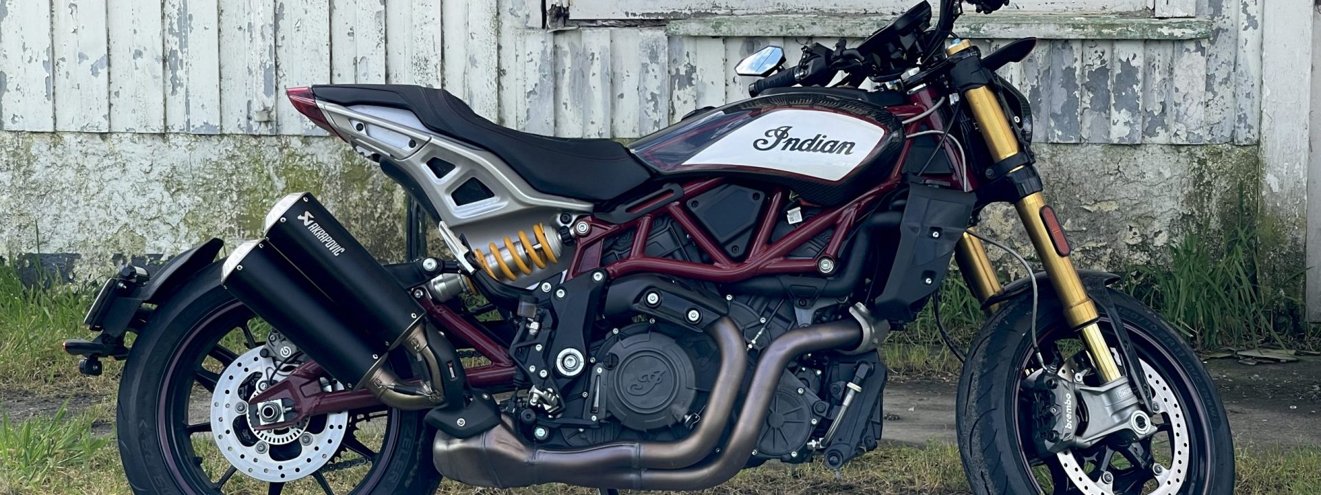 FTR 1200 motorcycle parked in front of a derelict house in the Wairarapa.